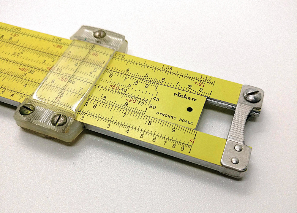 Pickett N600-ES slide rule. This five-inch 'eye saver' yellow aluminum linear slide rule has a nylon indicator and is held together with stamped aluminum contoured posts.